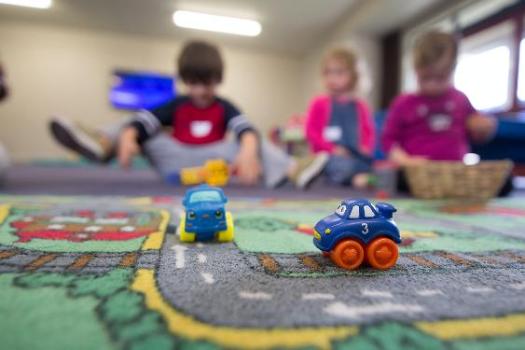 photo of kids playing with toys