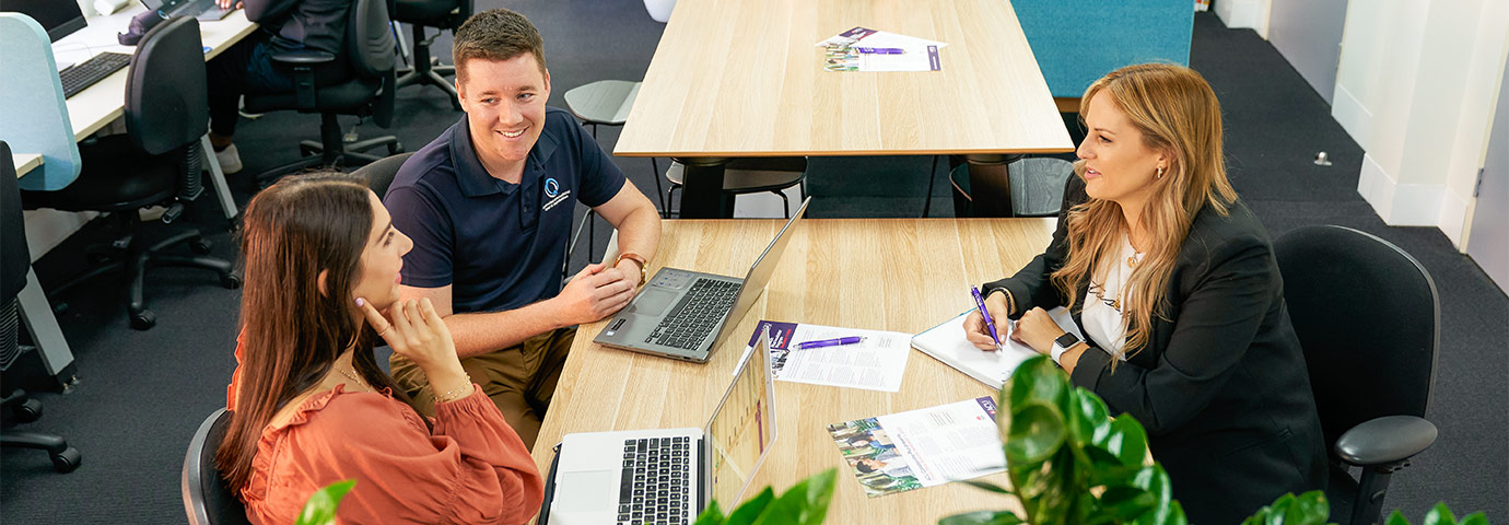 A conversation between an ACU staff member and members from a partner organisation