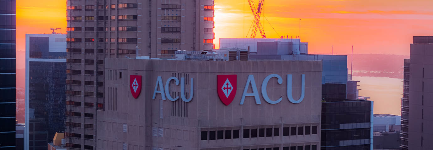ACU campus building with sunset behind