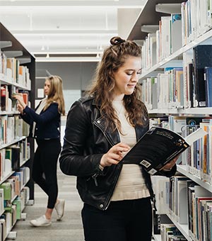 girl reading in a library