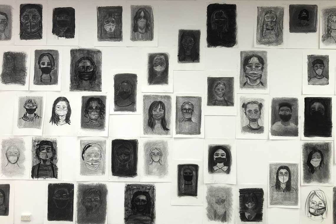 wall with portraits in black and white