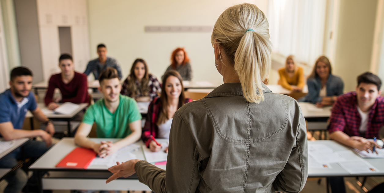 ACU Educational leadership lecturer standing in front of class