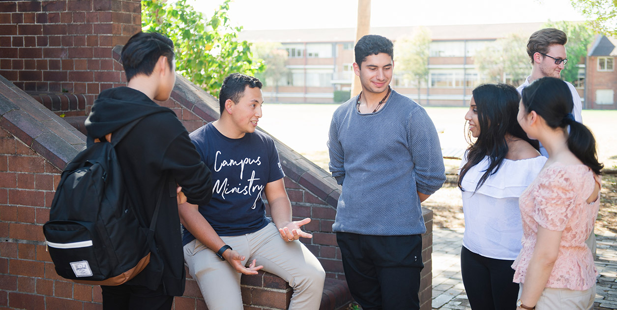 A group of people are standing around outside