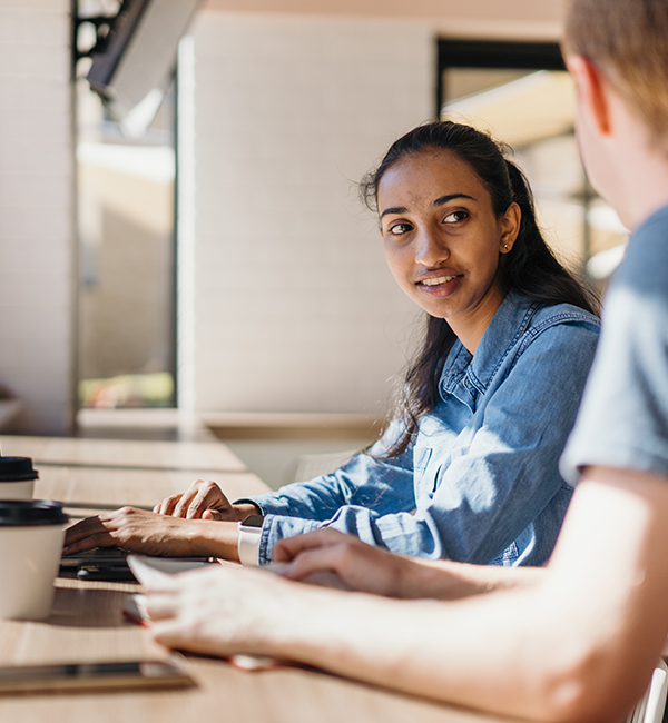 ACU creative writing student chatting to a fellow student
