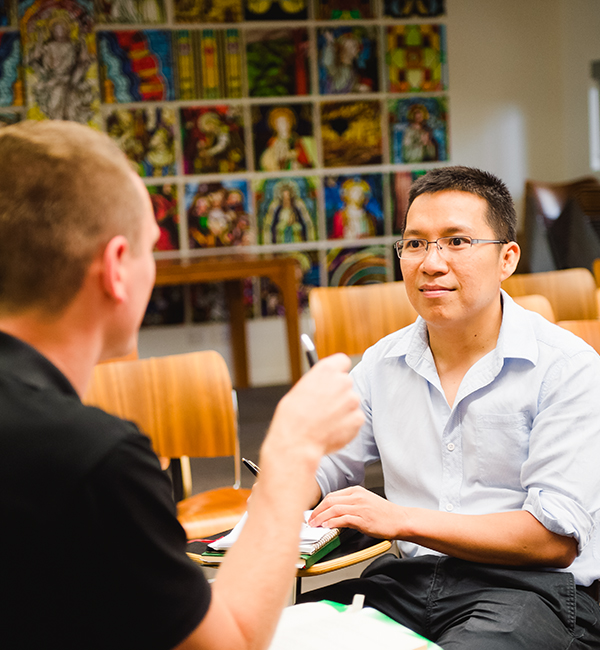 ACU moral theology students discussing their word