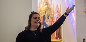 Woman singing in Church.