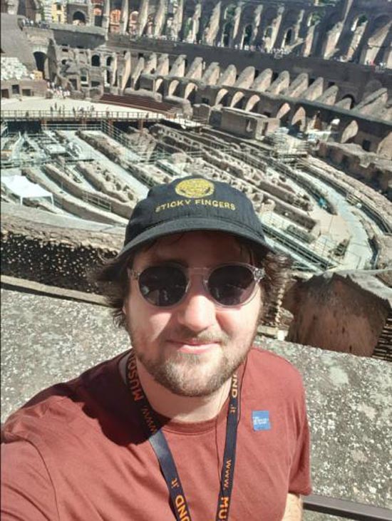  Cam Buck taking a selfie photograph in the Colosseum, Rome, Italy.