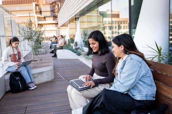 two students sitting and talking