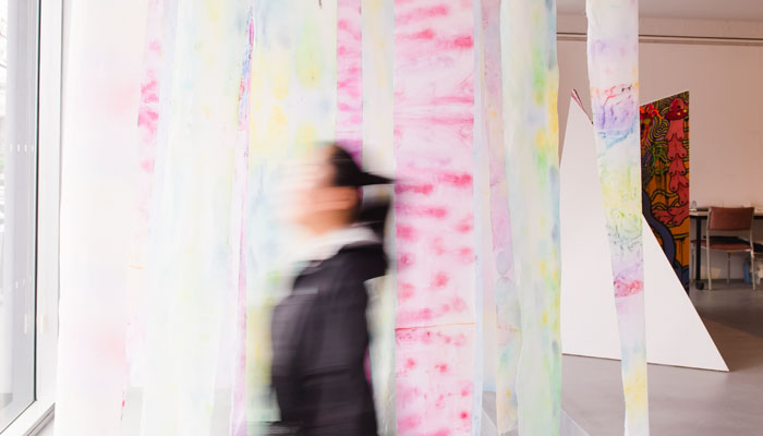 Woman walking past Melbourne Gallery